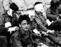 Wounded us soldiers omaha beach.png
